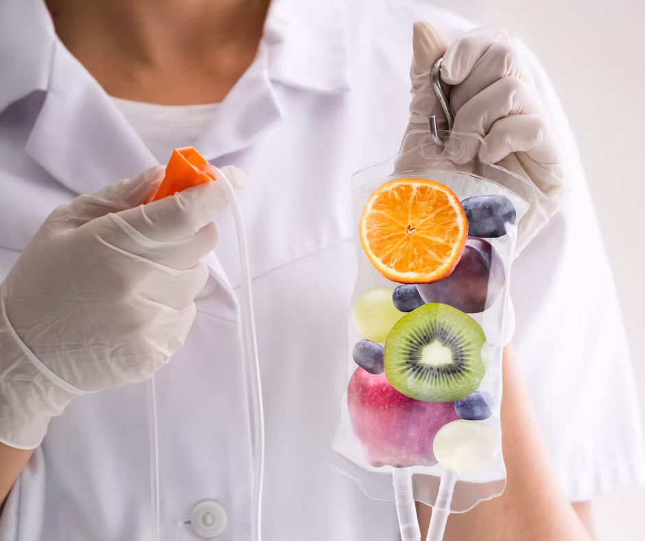 Photo of an IV bag with slices of fruit inside, representing a Myers Cocktail IV treatment.